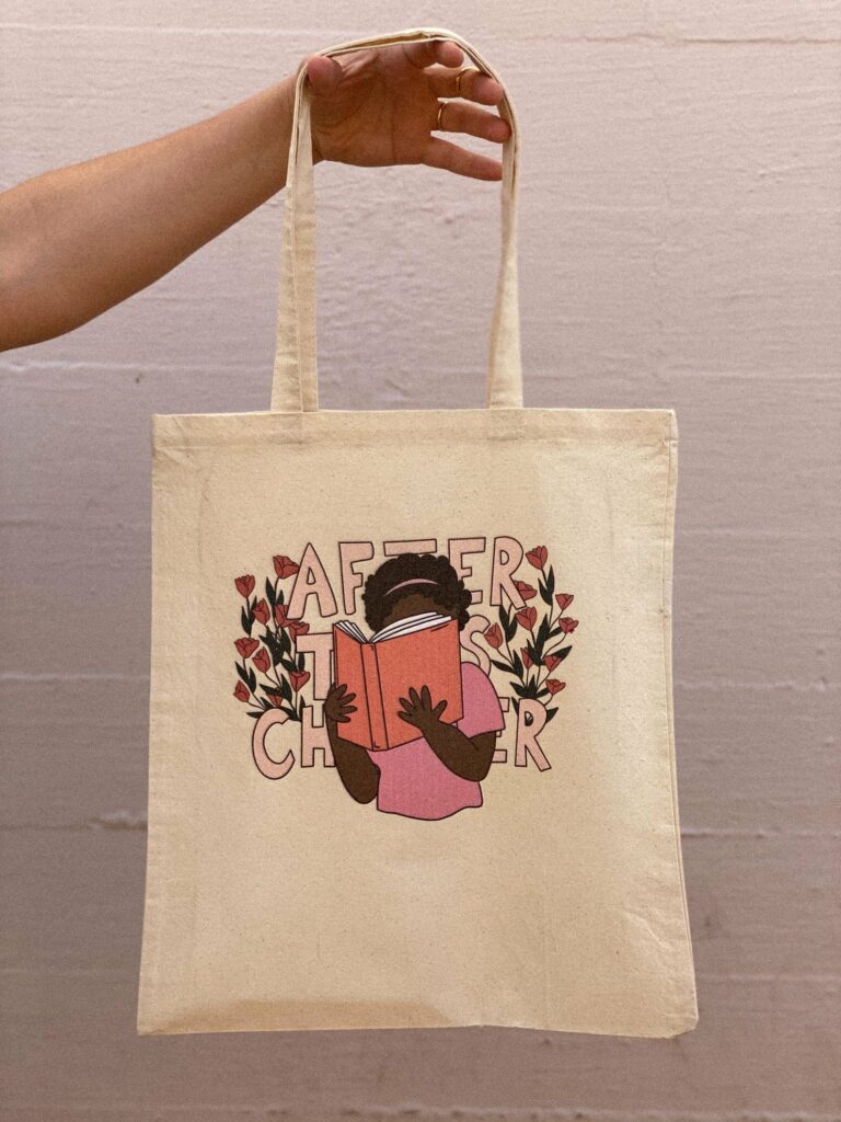 Image of a canvas tote bag, featuring a black girl reading a book. Behind her image are the words "after this chapter."