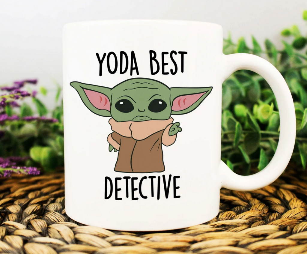 a white mug with a graphic image of Baby Yoda that says Yoda Best Detective