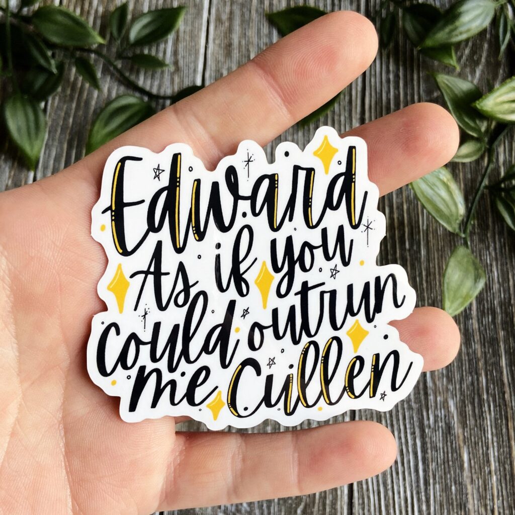 Image of a white hand holding a sticker that reads "Edward as if you could outrun me Cullen."