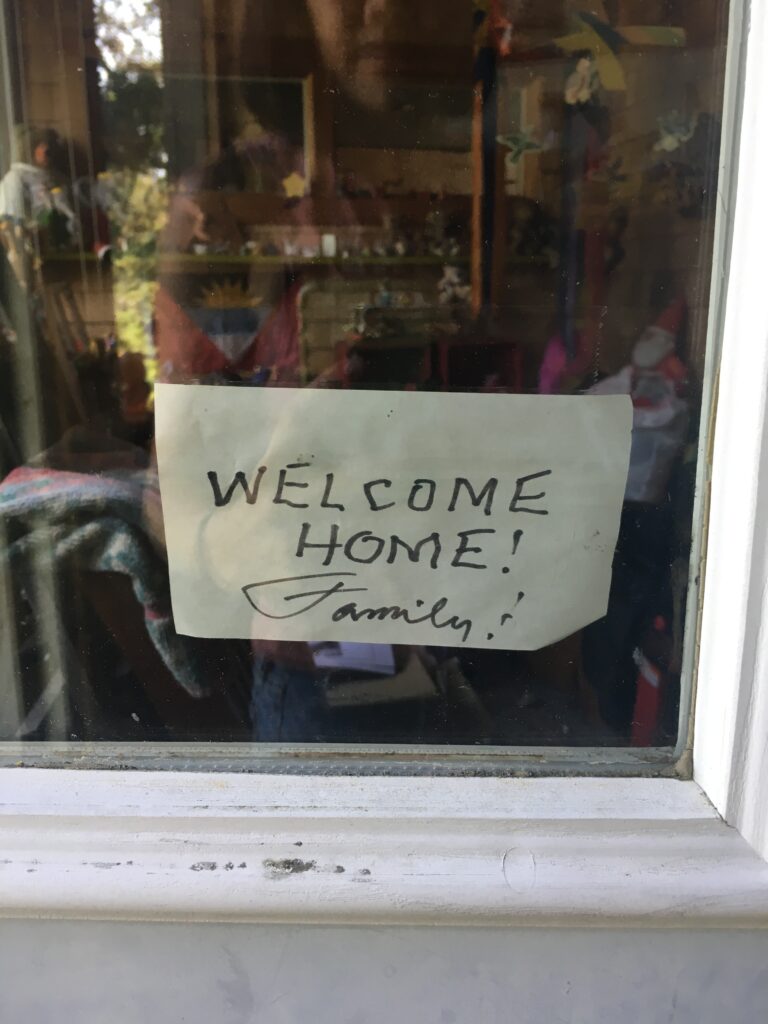 A sign in the window of his home.