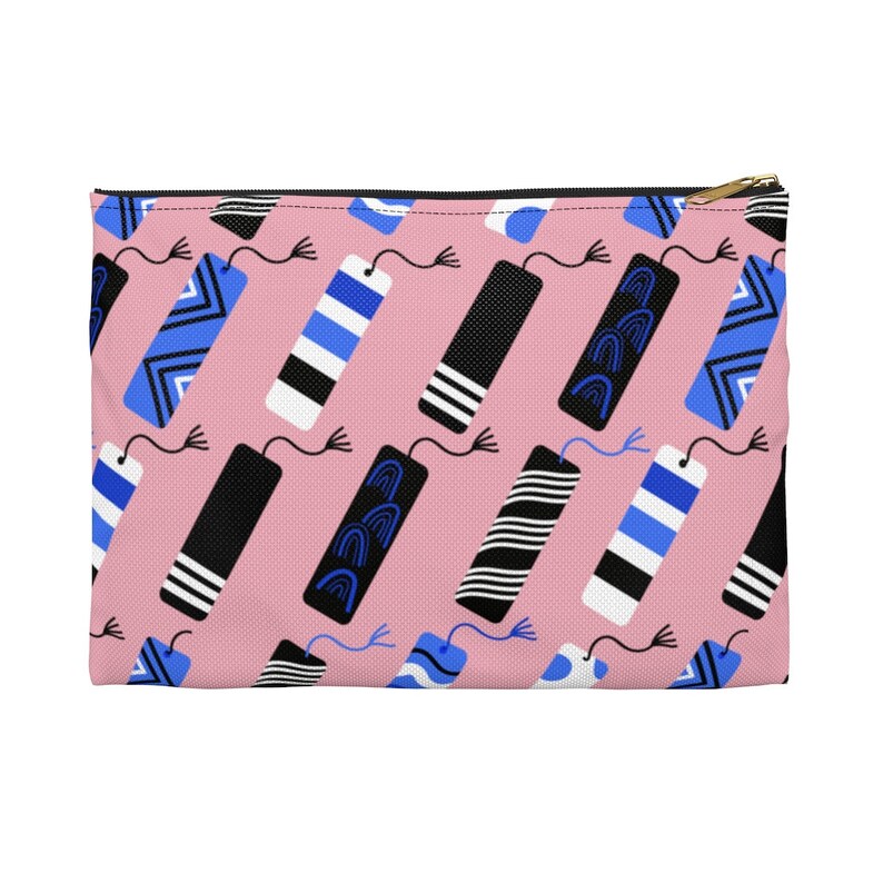 Image of a pink pouch with blue, black, and white bookmarks.