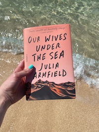 Our Wives Under the Sea book at the beach
